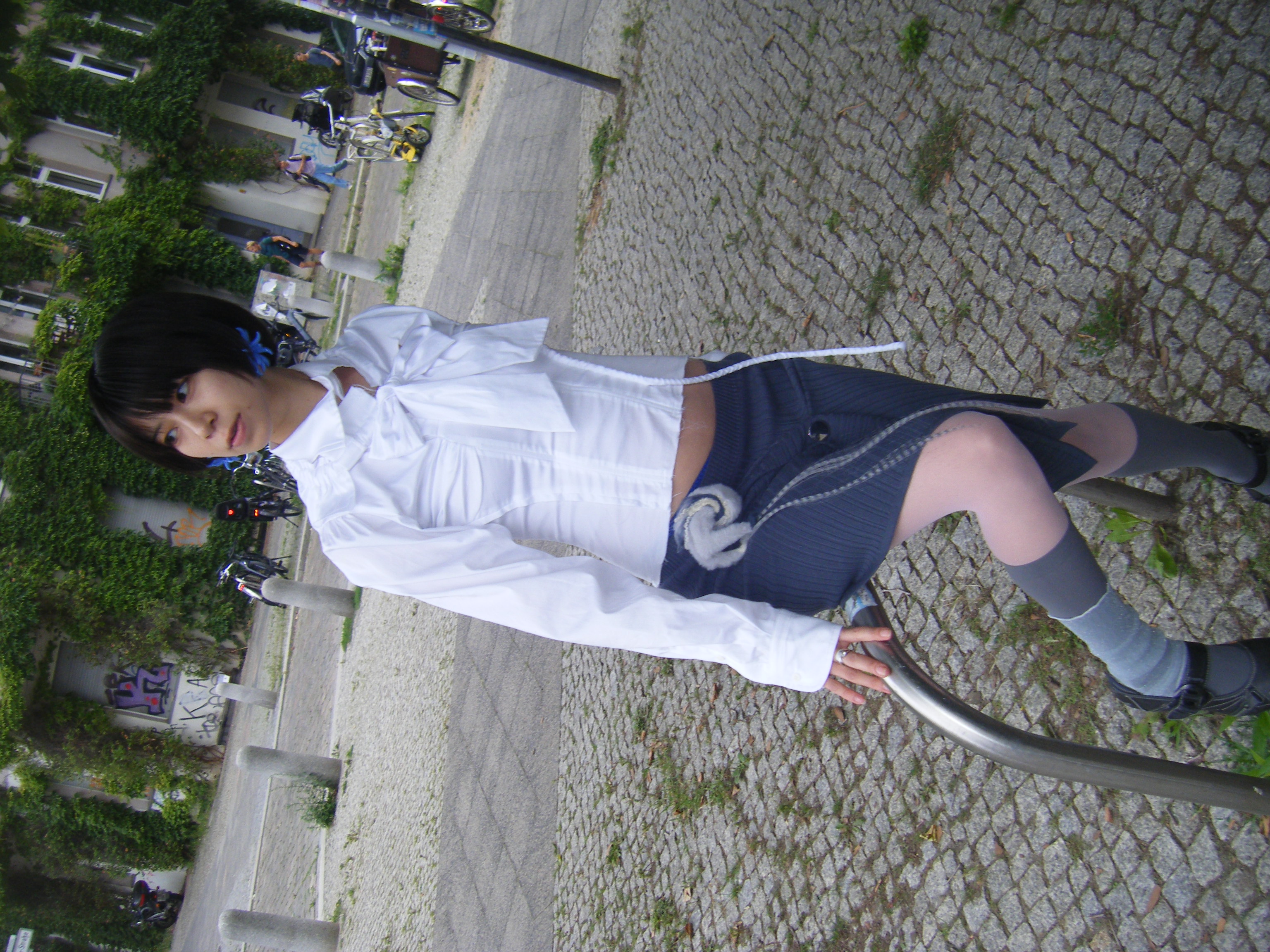 Soft sculptural creatures arranged on grey knit sweater fabric