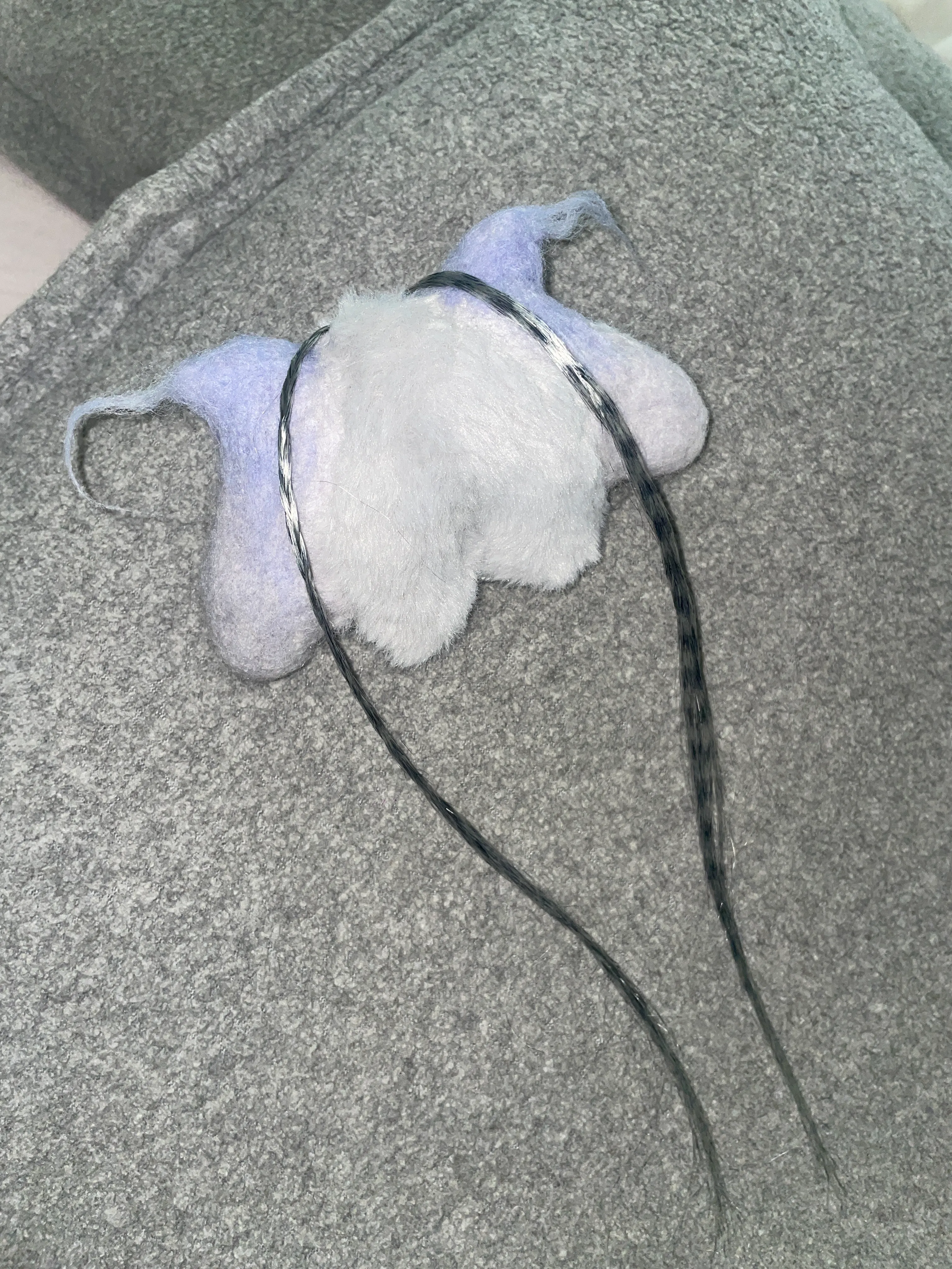 Lampi brooch shown from different angle highlighting sculptural details