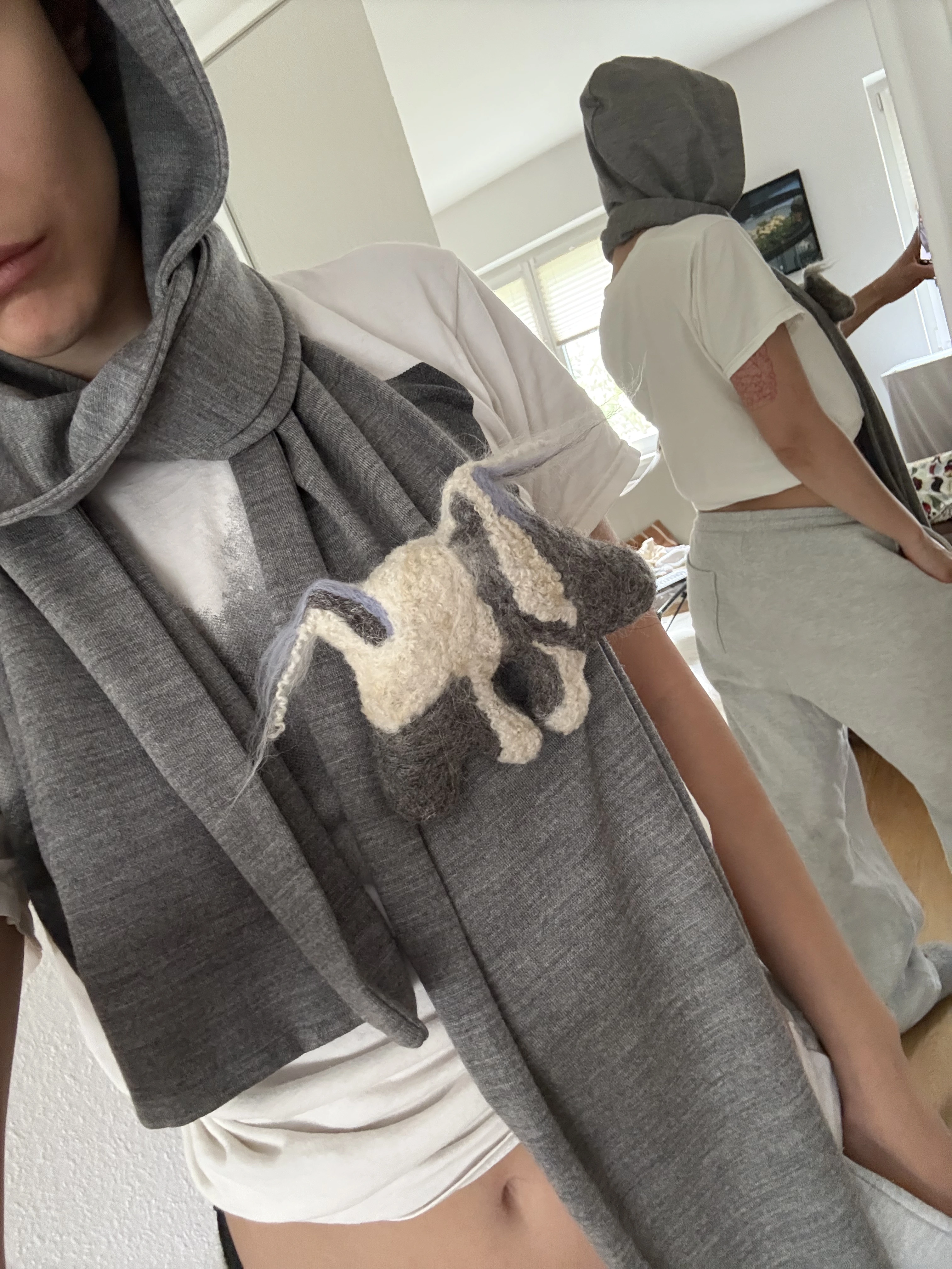 Lampi v2 brooch shown worn on clothing, displaying scale and wearability