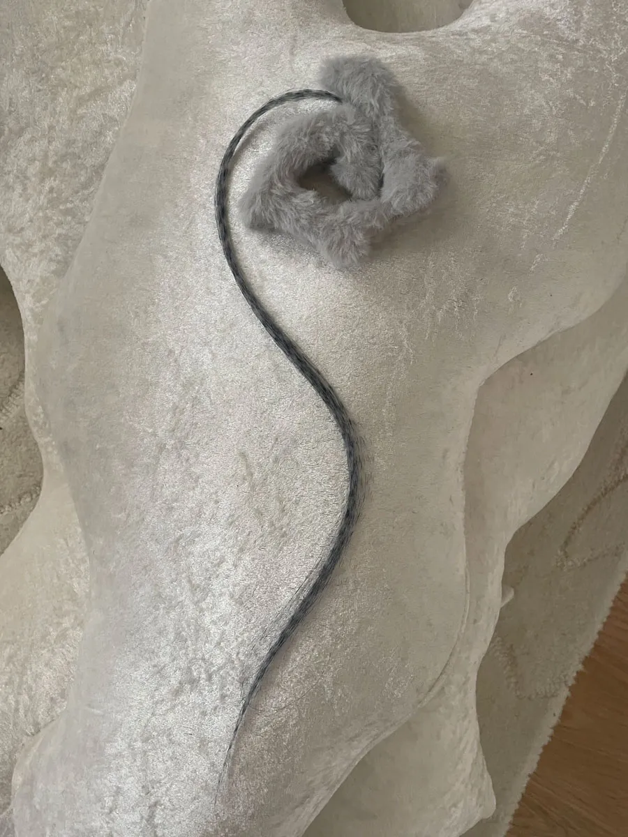 Delicate protective brooch amulet with soft rounded form in muted tones
